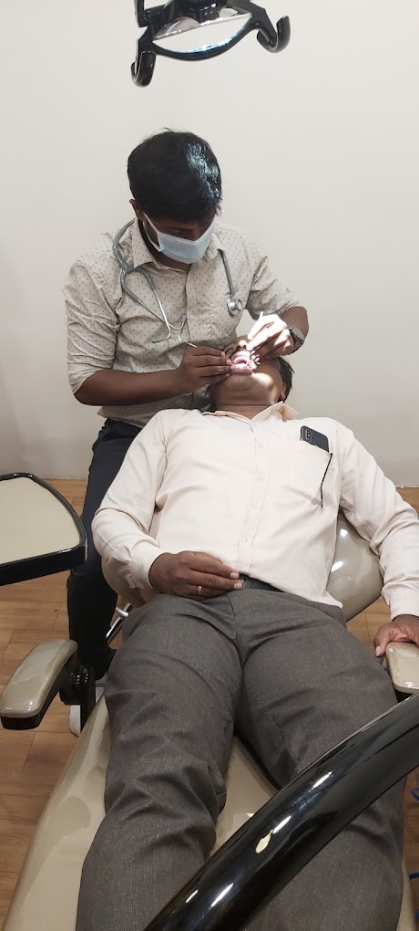 Dr. Nemanth Sanjeev treating a patient